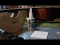 Jamie Surette fixes a Taylor's black binding with Gluboost