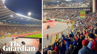 'All together': football fans at Belgium v Sweden chant message of support after shooting