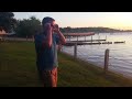 colorblind guy tries on enchroma color for the colorblind glasses at sunset