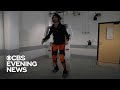 Paralyzed man walks using exoskeleton