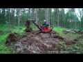 atv backhoe removing stumps and topsoil