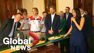 Meghan Markle gets a surprise as she launches mini Formula 1 cars at high speed in Melbourne