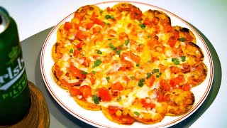 Super easy! Make Nacho Pizza, a party food you'll love in one bite!