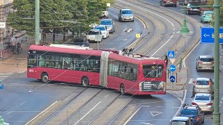 Red Articulated Trolleybus Turning on Road Junction | Stock Footage - ASW Media