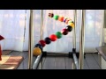 A simple demo of order and chaos (and order again) - Home made Pendulum Wave with 15 billiard balls