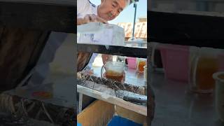 Thai Grandpa making iced lemon tea using the old method