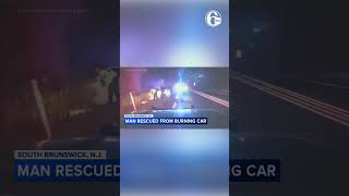 Dramatic video: Police pull driver from car fire in harrowing rescue