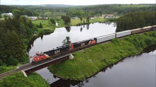 Awesome Aerial 4K View! Long manifest Train CN 507 Passing Palmers Pond - Dorchester, NB