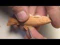 carving a brook trout pendant