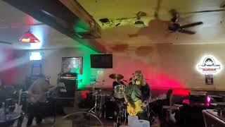 “Rockin in the free world” by Top heavy live at Mimi’s subway and bar on 10/19/24