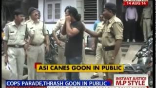 Indore cops parade,thrash goon in public