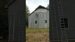 Using a bunch of ladders to paint the side of a house. #construction