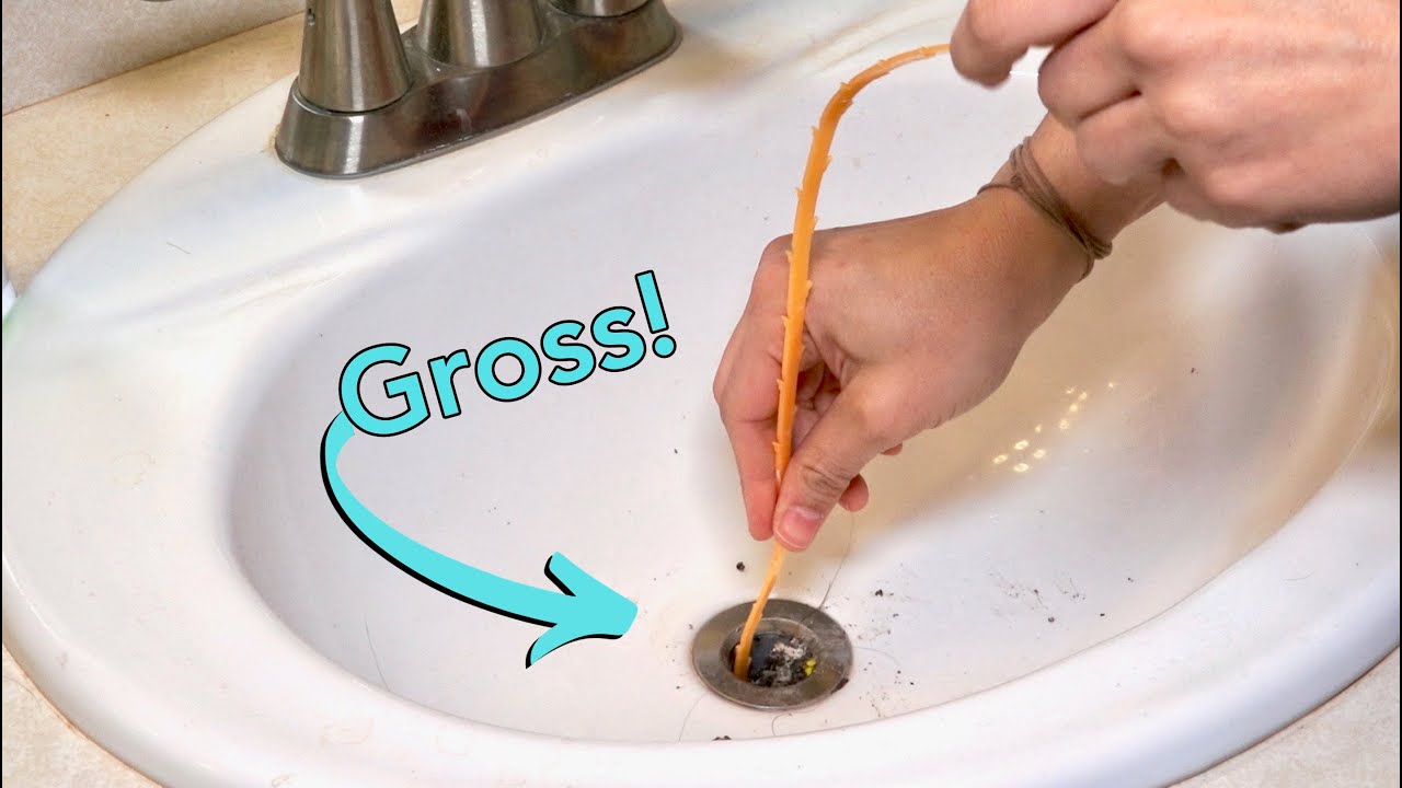 How To Clean A Clogged Sink & Remove Stopper - YouTube