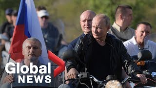 Vladimir Putin attends bike show on annexed peninsula of Crimea