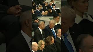 Trump and Obama are seen talking before Jimmy Carter's funeral