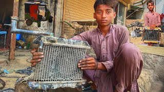 This young mechanic old radiator repair