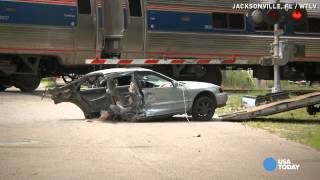 Video shows Amtrak train slice car in half