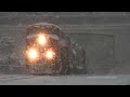 trains in heavy blinding snow blizzard conditions