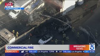 Commercial building fire sends thick plume of smoke over downtown L.A. during morning commute