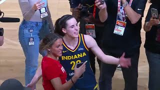 Caitlin Clark embraces Iowa teammate Gabbie Marshall after her home preseason de