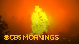 Dozens of massive wildfires rage across western U.S.