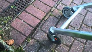 Shopping cart wheel lock system