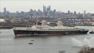 The SS United States begins journey down the Delaware River and out of Philadelphia