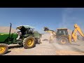 jcb 3dx backhoe loading mud in tractor mahindra 415 di and mahindra b275 di mud tractor