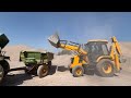 jcb 3dx backhoe loading mud in tractor mahindra 415 di and mahindra b275 di mud tractor