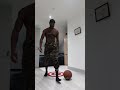 handstand push up mobility conditioning with a basketball head touching trainingcamp shorts