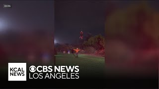 Couple rescued from rushing waters in Orange County