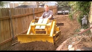 Mini Bull Dozer Struck Magna Trac Junior moving dirt