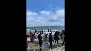 UKRAINIAN CIVILIANS WAIT RUSSIAN ATTACK ON #ODESSA BEACH