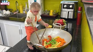 Smart monkey Lily helps dad cook carrots for breakfast