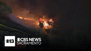 Car catches fire after crash off I-80