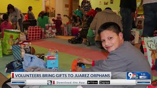 Volunteers bring gifts to orphans