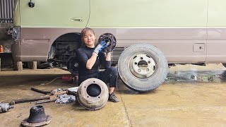 The repair girl quickly changed the front wheel bearings for the passenger car