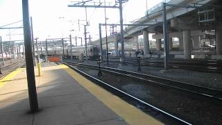 (HD) Tropicana wrapped Cab-Car 1507 arrives South Station, while 720 is arriving to.