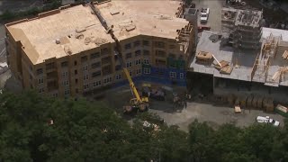 Crane topples onto apartment building under construction in Winchester