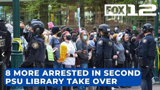 Police arrest 8 more after protesters rip down barricades, break into PSU library again