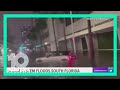 People climb out of sunroofs as cars get stuck in Miami flood waters