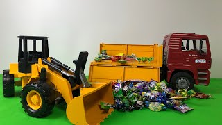 TOY DUMP TRUCK WITH CANDIES ROLLED OVER | BACKHOE AND DUMP TRUCK