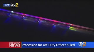 Procession for fallen off-duty police officer shot and killed in Downey