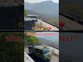 Downhill and uphill buses experienced drivers in sharp curve ghat road hairpin bend Uturn