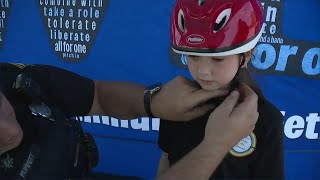 Brunswick police hold drive-thru event to distribute bicycle helmets to children in need