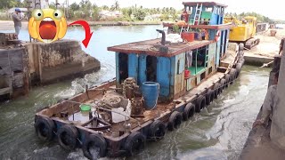 [926] Two tugboats pulled the giant barge through the gates of the spectacular dam