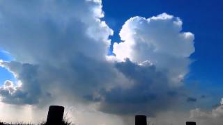 How can cumulonimbus clouds produce rain and hail?