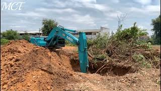 Clearing forests and landfills using Kobelco SK200-8