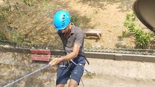 Rappelling from building. Rappelling