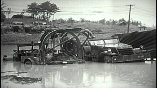 Bomb disposal truck  and  armored car in flood water offshore in Okinawa, Japan. HD Stock Footage